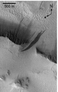 Image 2: An Image of the same area taken on 2002-06-10. A large new slope streak formed, while numerous other streaks persisted. North is up and illumination is from the lower left (Schorghofer et al. 2007).
